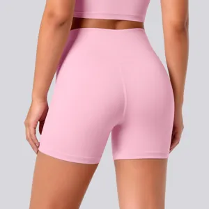 Detail view of pink high-waisted yoga shorts back, showing breathable stretch fitness fabric.