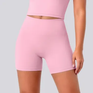 High-waisted pink yoga shorts close-up, premium breathable stretch fabric, fitness activewear detail.