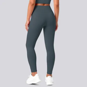 Detail shot showing the back view of high-waisted seamless yoga leggings in dark grey color.