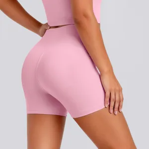 Close-up detail of women pink high waist yoga shorts, soft stretch fitness activewear fabric.