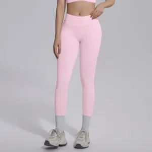 Close-up detail of pink seamless high-waist V-waist yoga leggings, soft breathable fabric.