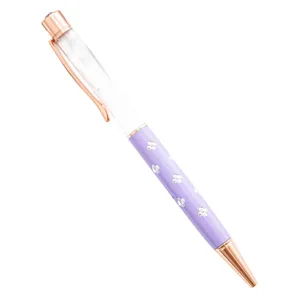 Stylo à bille violet élégant avec motif trèfle en cristal et finitions en métal or rose.