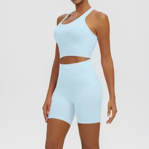 Light blue yoga set detail showing breathable ribbed fabric, sports bra and high-waist shorts.