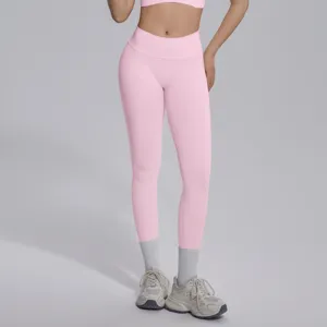 Detail view of seamless knit V-waist yoga pants in pink, showing fit and texture.