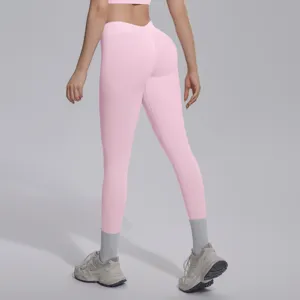 Detailed view of pink seamless V-waist fitness yoga leggings, breathable butt lifting design.