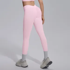 Detail view of pink seamless V-waist yoga pants, breathable fitness lifting leggings.