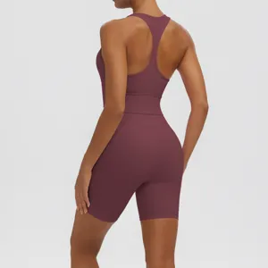 Detailed view of women's seamless racerback sports bra and tight yoga shorts fitness set.