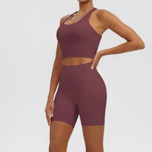 Solid color breathable yoga set detail with supportive sports bra and high waist shorts.