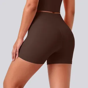 Detail view of high-waist stretchy breathable yoga shorts in brown, activewear active fitness.