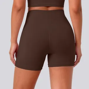 Detail view of back design, high waist fit, brown stretchy yoga shorts fabric close up.
