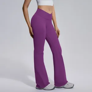 High waist crossover purple flare yoga pants detail shot, seamless stretchy fitness leggings.
