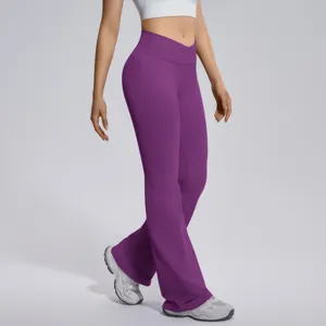 Detail shot of purple crossover high-waist flare yoga pants, highlighting stretchy fabric.