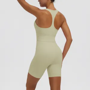 Solid color seamless athletic yoga set with racerback sports bra and biker shorts for women.