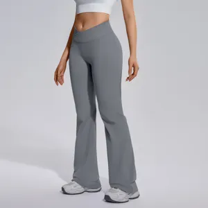 Crossover waist flared yoga pants for women, seamless high stretch fitness running wear detail view.