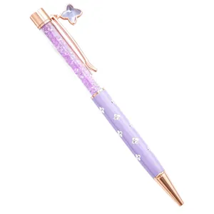 Purple crystal ballpoint pen with rose gold metal accents and sparkling rhinestone clover decor.