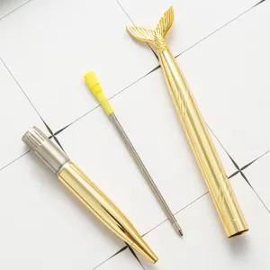 Gold electroplated metal ballpoint pen with creative mermaid tail design for cute stationery.
