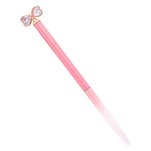Pink glitter ballpoint pen with crystal bow decoration, cute and stylish metal writing tool.