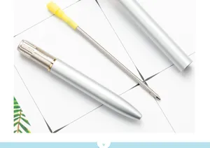 Detailed view of the metal ballpoint pen components, showing refill and silver barrel.