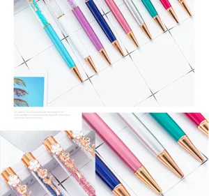Colorful crystal ballpoint pens featuring sparkling diamonds and elegant clover flower clips for office.