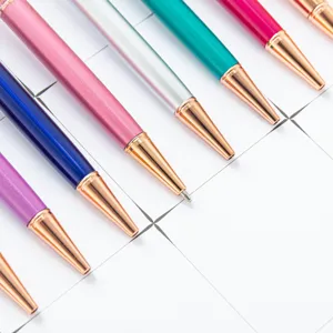 Colorful metal ballpoint pens set with rose gold accents and clover clips for office use.