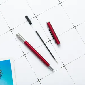 Red metal ballpoint pen with removable cap and refill, perfect for office and gifts.