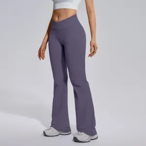 Cross-waist flare yoga pants detail showing slim fit and high stretch workout fabric.