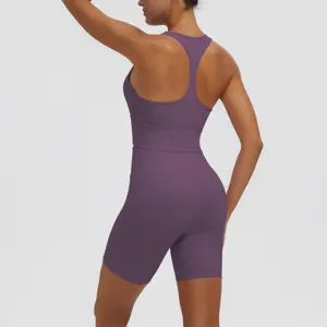 Back detail of solid purple women sports bra and fitness shorts set, breathable gym activewear.