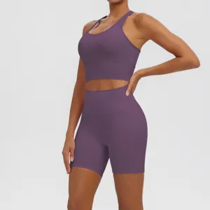 Detailed view of the purple athletic yoga set showing tight fit, breathable fabric, and racerback design.