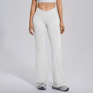 Detailed view of women's white cross-waist flare yoga pants, high-waist tummy control.