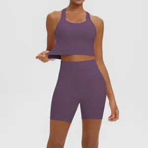 Solid color ribbed seamless yoga set detail view featuring active sports bra and high waist shorts.