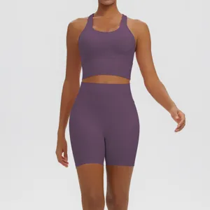 Close-up detail view of the purple seamless sports bra and high waist fitness shorts set.