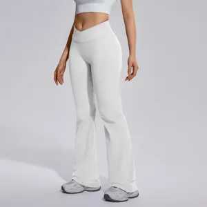 Detail shot of white crossover flare yoga pants, showing soft high-elastic fabric design.