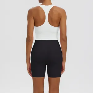 Back view detail of white racerback sports bra and black yoga shorts fitness athletic set.