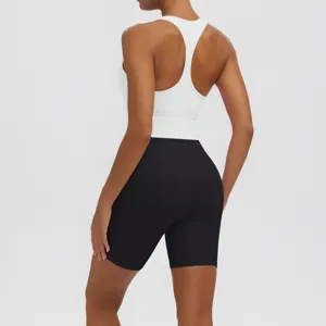 Back view detail of women's white racerback sports bra and black yoga shorts set.