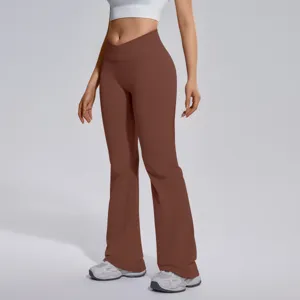 Cross waist flare yoga pants detail shot, showing high elasticity and slim fit design.