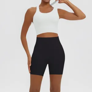 Solid color athletic yoga set with a breathable sports bra and high waist shorts for women.