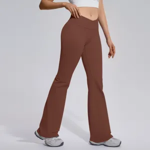 Detail shot of brown cross-waist flared yoga pants, high stretch and slimming fit.