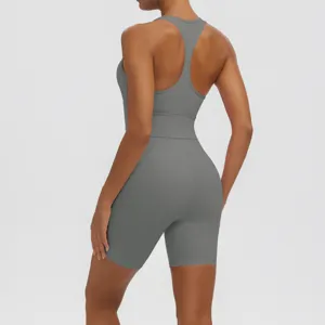 Detail view of solid grey racerback crop top and biker shorts yoga set for women workout.