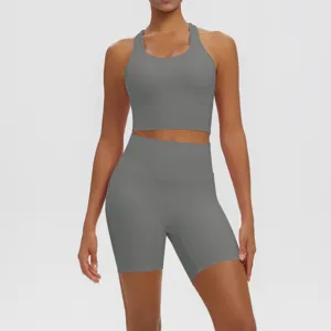 Solid grey two piece workout set with racerback sports bra and high waist biker shorts.
