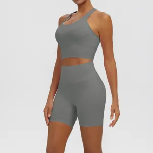 Close-up detail of women's seamless breathable solid grey yoga fitness workout two-piece set.