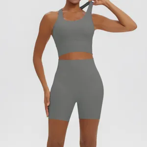 Solid color ribbed yoga activewear set detail featuring supportive sports bra and shorts.