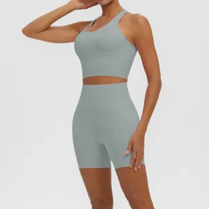 Solid grey athletic yoga set with breathable sports bra and high waisted fitness shorts.