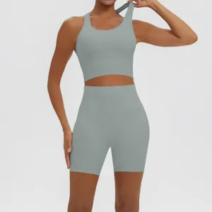 Solid color ribbed yoga set detail showing the breathable activewear crop top and high-waisted shorts.