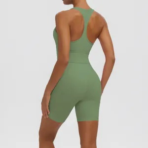 Green ribbed yoga set for women, featuring a racerback sports bra and high-waisted shorts.