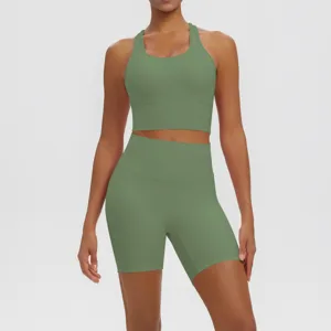 Green athletic yoga set detail featuring breathable crop top and high-waist shorts.