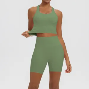 Close-up view of solid green yoga activewear set fabric and stretch details for women fitness.