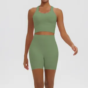 Solid color yoga set detail featuring breathable ribbed crop top and high waist workout shorts.