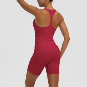 Back view detail of women solid color racerback sports bra and fitness biker shorts set.