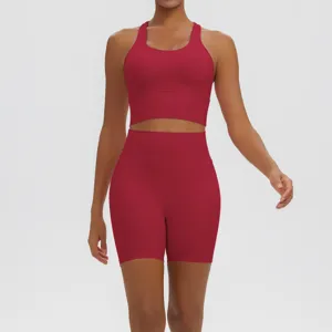 Detail view of a solid color seamless athletic yoga set featuring a racerback bra and shorts.