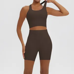 Detailed view of the dark brown two-piece yoga set, showing the sports bra and shorts.